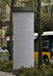 City Scenery - Advertising Pillar With Traffic Stock Photo