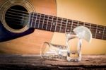 Glass Of Vodka And Classical Guitar Stock Photo