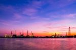 Oil Refinery Against Beautiful Sunrise Stock Photo