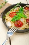 Spaghetti Pasta With Baked Cherry Tomatoes And Basil Stock Photo