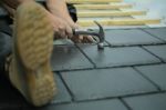 Tiler Laying Tiles On Roof Stock Photo