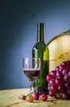 Glass Of Red Wine On A Wooden Stock Photo