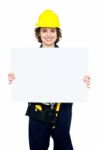 Female Worker Holding Blank Whiteboard Stock Photo