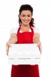 Woman Chef Holding Pizza Box Stock Photo