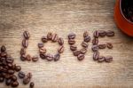 Coffee Bean Love On The Wooden Floor Stock Photo