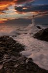 The Lighthouse And The Sea Stock Photo