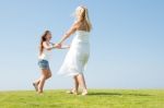 Mum And Daughter Playing in garden Stock Photo