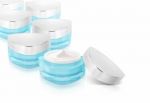 Many Blue Triangle Cosmetic Jar On White Background Stock Photo