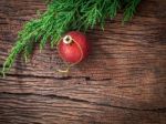 Christmas Fir Tree With Decoration On Dark Wooden Board Stock Photo