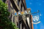 Hanging Sign In Riquewihr In Haut-rhin Alsace France Stock Photo