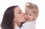 Smiling Mother With Her Daughter Isolated On White Stock Photo