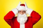 Stressed Out Santa Pressing Against His Temples Stock Photo