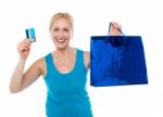 Female Holding Bag And Credit Card Stock Photo