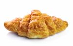 Fresh And Tasty Croissant Over White Background Stock Photo