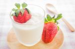 Glass Of Yogurt With Fresh Strawberry Stock Photo