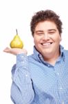 Chubby Boy And Pear Stock Photo