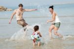 Family In The Beach Stock Photo