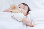 Little Asian Girl Lying  On A Medical Bed Stock Photo