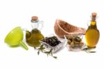 Green And Black Olives With Olive Oil Bottles Stock Photo