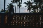 Little Boy Standing At A Balcony Looking Out Thinking Stock Photo