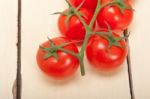 Fresh Cherry Tomatoes On A Cluster Stock Photo