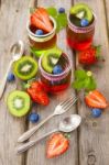 Red And Green Jelly Served With Fruit Stock Photo