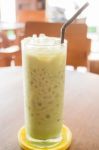 Glass Of Iced Green Tea Latte Stock Photo