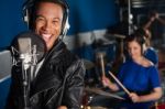 Singer Recording A Song In Studio Stock Photo