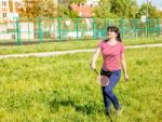 Young Beautiful Woman Playing Badminton Stock Photo