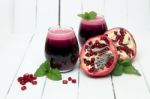 Fresh Tropical Pomegranate Juice Isolated On A White Background Stock Photo