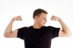 Muscular Man Looking His Muscles Stock Photo