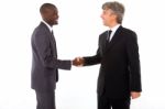 Businessmen Shaking Hands Stock Photo