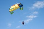 Two People Paragliding Off A Beach In Gran Canaria Stock Photo