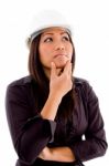 Female Architect Thinking And Wearing Hardhat Stock Photo