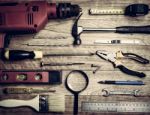 Set Of Tools Over A Wood Background Stock Photo