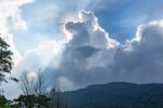 The Beauty Of The Sky When Light Hits The Clouds And Mountain Stock Photo