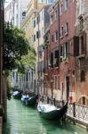 Gondolas Moored Along A Canal In Venice Stock Photo