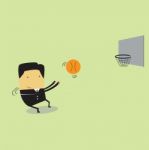 Business Man Throwing A Basketball Stock Photo