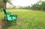 Bench Under The Tree In The Gardens Stock Photo