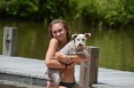 Girl Holding Schnauzer Stock Photo