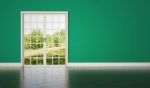 White Room Door On Green Wall Background Stock Photo