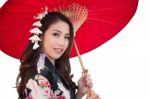 Beautiful Young Asian Woman Wearing Traditional Japanese Kimono With Red Umbrella Isolated On White Background Stock Photo