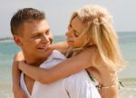 Hugging Couple At Beach Stock Photo