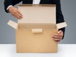 Man Opening Cardboard Box Stock Photo