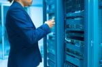 Man Fix Server Network In Data Center Room Stock Photo