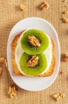 Toast With Kiwi, Cheese And Walnuts Stock Photo