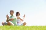 Young Couple Doing Meditating Stock Photo