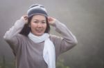 Asian Woman In Fog Stock Photo