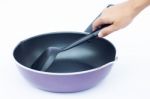 Hand With Non Stick Frying Pan On White Background Stock Photo