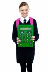 School Girl Holding Large Green Calculator Stock Photo